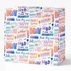 Colorful rainbow script gift bag with birthday designs for birthday from Parte Haus party supply store in Bethesda MD