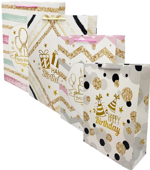 Gold white and pastel birthday gift bags with glitter accents birthday theme from Parte Haus party supply store in Bethesda MD