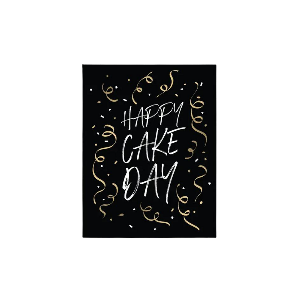 Black and gold birthday greeting card with Happy Cake Day text and festive swirls from Parte Haus party supply store in Bethesda Maryland