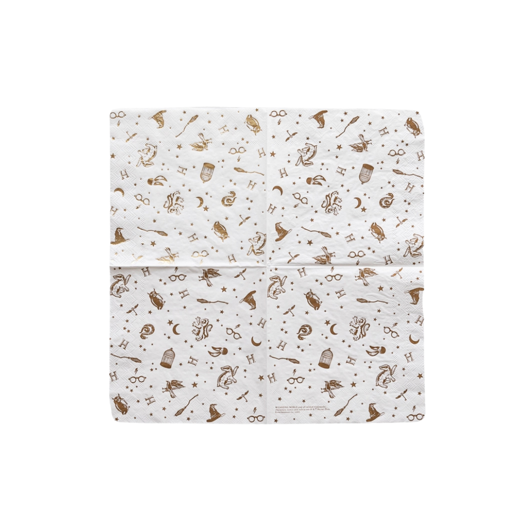 white Harry Potter napkin with gold illustrations for wizard birthday theme from Parte Haus party supply store in Bethesda MD