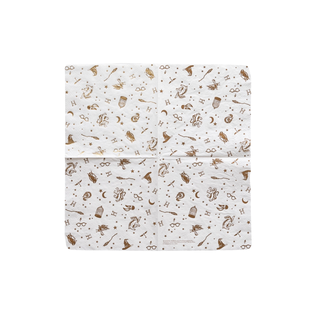 white Harry Potter napkin with gold illustrations for wizard birthday theme from Parte Haus party supply store in Bethesda MD