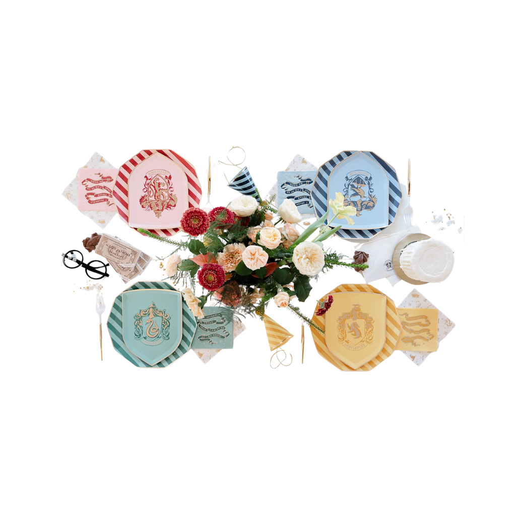 Multicolor Harry Potter house plates and napkins with floral centerpiece birthday theme from Parte Haus party supply store in Bethesda MD