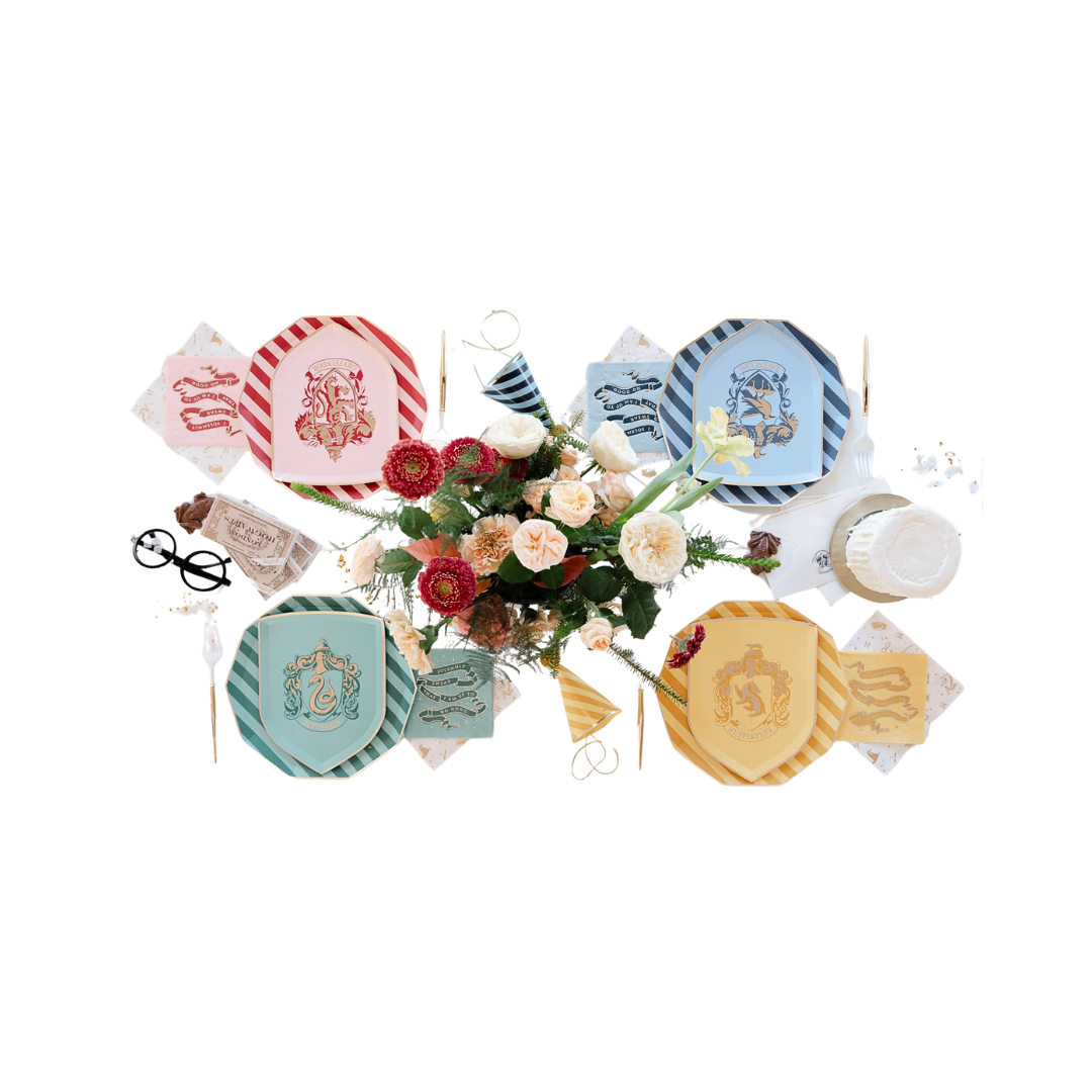 Multicolor Harry Potter house plates and napkins with floral centerpiece birthday theme from Parte Haus party supply store in Bethesda MD