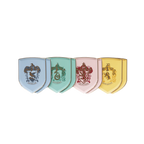 Blue green pink yellow shield shaped paper plates with Hogwarts house crests Harry Potter theme from Parte Haus party supply store in Bethesda MD