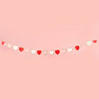 Red and white heart garland with cutout hearts for Valentine's Day from Parte Haus party supply store in Bethesda MD