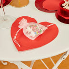 Red heart shaped paper napkin with candy favor bag for Valentine or love theme from Parte Haus party supply store in Bethesda Maryland