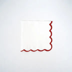 White and red scallop cocktail napkin with festive edge for holiday from Parte Haus party supply store in Bethesda MD.