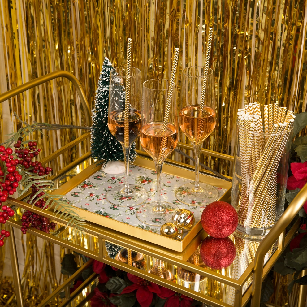 Gold holiday mimosa bar decoration kit with straws glasses and ornaments Christmas from Parte Haus party supply store in Bethesda MD.