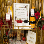 Gold and red holiday mimosa bar decoration kit with fruit holiday theme from Parte Haus party supply store in Bethesda MD