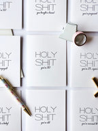 White letterpress anniversary greeting cards with bold text for humorous celebration from Parte Haus party supply store in Bethesda MD