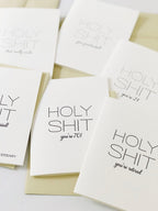 White letterpress anniversary cards with bold black text humor theme from Parte Haus party supply store in Bethesda MD.