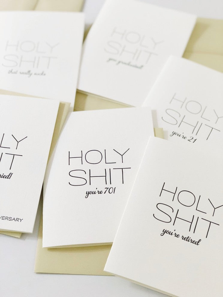 White letterpress anniversary cards with bold black text humor theme from Parte Haus party supply store in Bethesda MD.