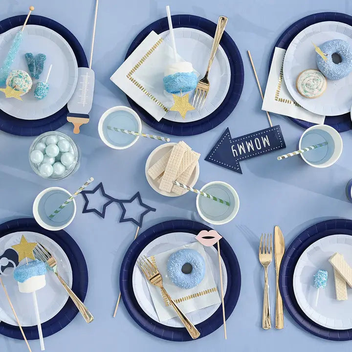 Baby blue photo props and tableware with treats for baby shower from Parte Haus party supply store in Bethesda MD