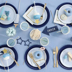 Baby blue photo props and tableware with treats for baby shower from Parte Haus party supply store in Bethesda MD