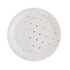 White paper plate with small round cutout holes from Parte Haus party supply store in Bethesda Maryland