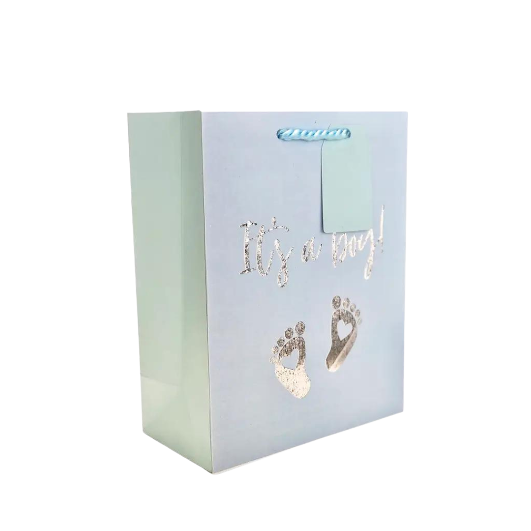 Light blue gift bag with gold It's a Boy text and baby footprints baby shower from Parte Haus party supply store in Bethesda MD