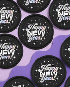 Black Happy New Year paper plates with stars for New Year’s Eve from Parte Haus party supply store in Bethesda MD