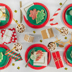 Red green holiday photo props and cookies displayed on Christmas table from Parte Haus party supply store in Bethesda MD