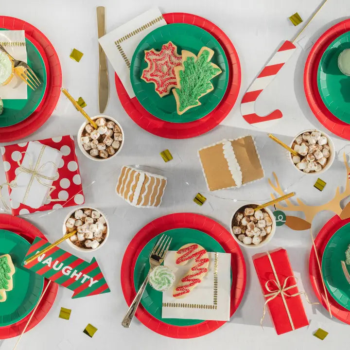 Red green holiday photo props and cookies displayed on Christmas table from Parte Haus party supply store in Bethesda MD