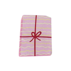 Pink Joy Petite Napkin with wavy lines and red bow birthday from Parte Haus party supply store in Bethesda MD
