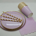 Light purple paper plates with gold trim cups straws and napkins for birthdays from Parte Haus party supply store in Bethesda MD