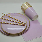 Light purple paper plates with gold trim cups straws and napkins for birthdays from Parte Haus party supply store in Bethesda MD