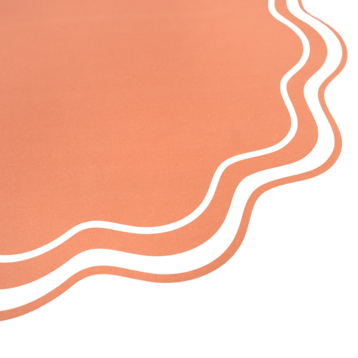 Peach scalloped edge placemat with layered design for birthday theme from Parte Haus party supply store in Bethesda MD