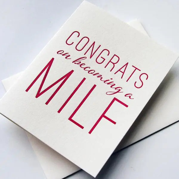 White letterpress greeting card with bold pink text for new baby congratulations from Parte Haus party supply store in Bethesda MD