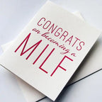 White letterpress greeting card with bold pink text for new baby congratulations from Parte Haus party supply store in Bethesda MD