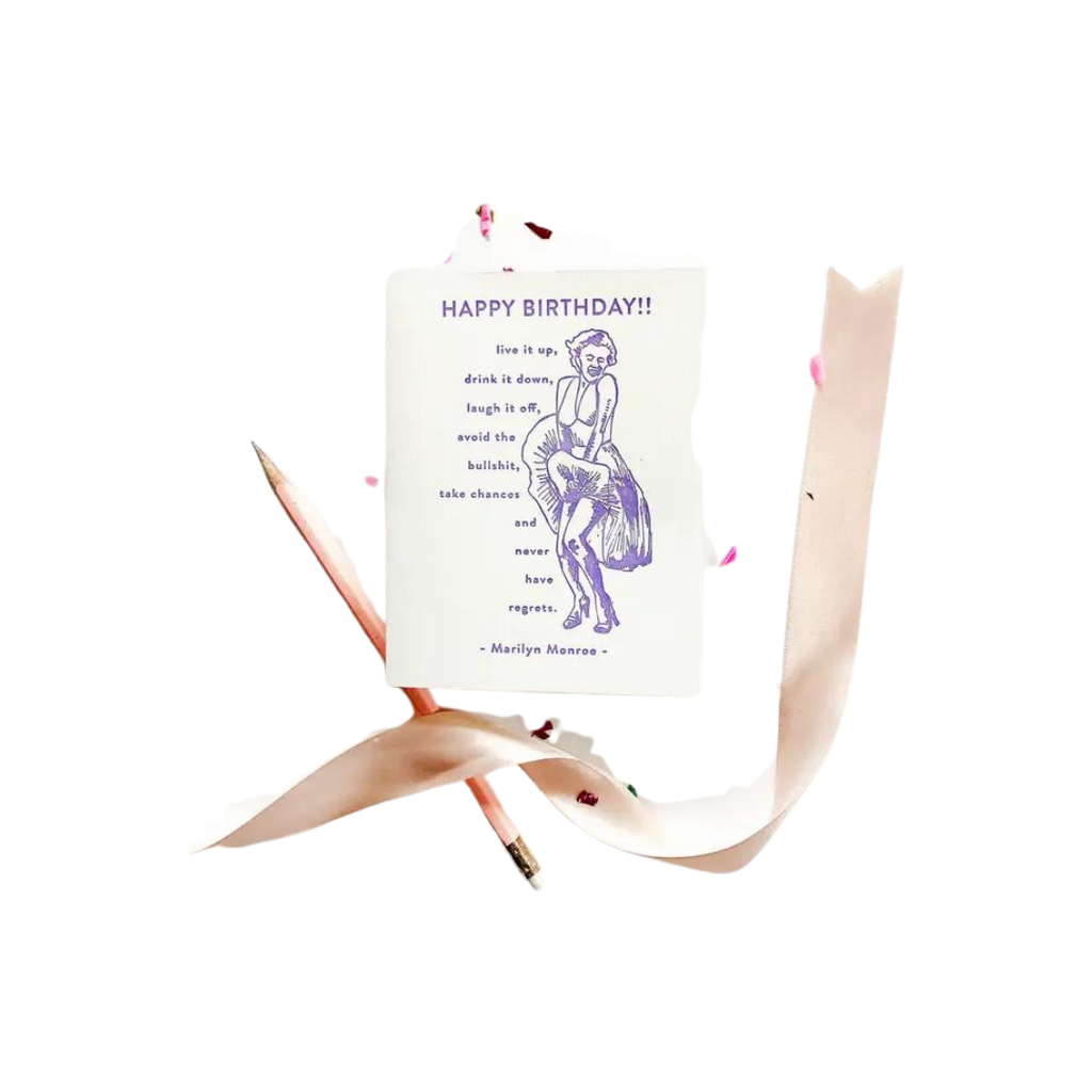 White and purple Marilyn Monroe birthday greeting card with ribbon for birthday from Parte Haus party supply store in Bethesda Maryland