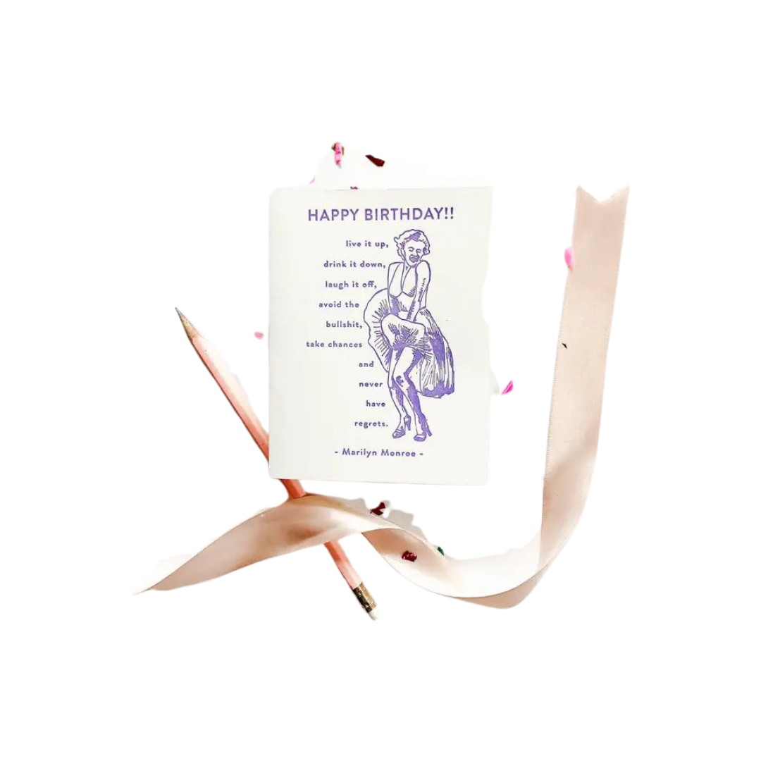White and purple Marilyn Monroe birthday greeting card with ribbon for birthday from Parte Haus party supply store in Bethesda Maryland