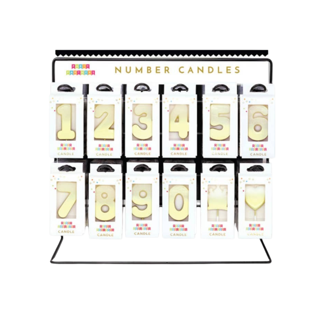 Metallic gold ombre number candles with heart and wine glass display for birthdays at Parte Haus party supply store in Bethesda Maryland