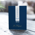 Navy blue Bar Mitzvah greeting card with modern white ribbon design from Parte Haus party supply store in Bethesda Maryland