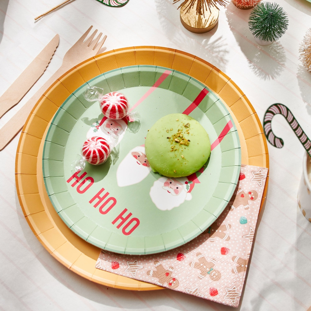 Multicolored Christmas large dinner plates with Santa design for holiday from Parte Haus party supply store in Bethesda MD
