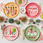 Multicolored Christmas dinner plates with festive characters holiday theme from Parte Haus party supply store in Bethesda Maryland