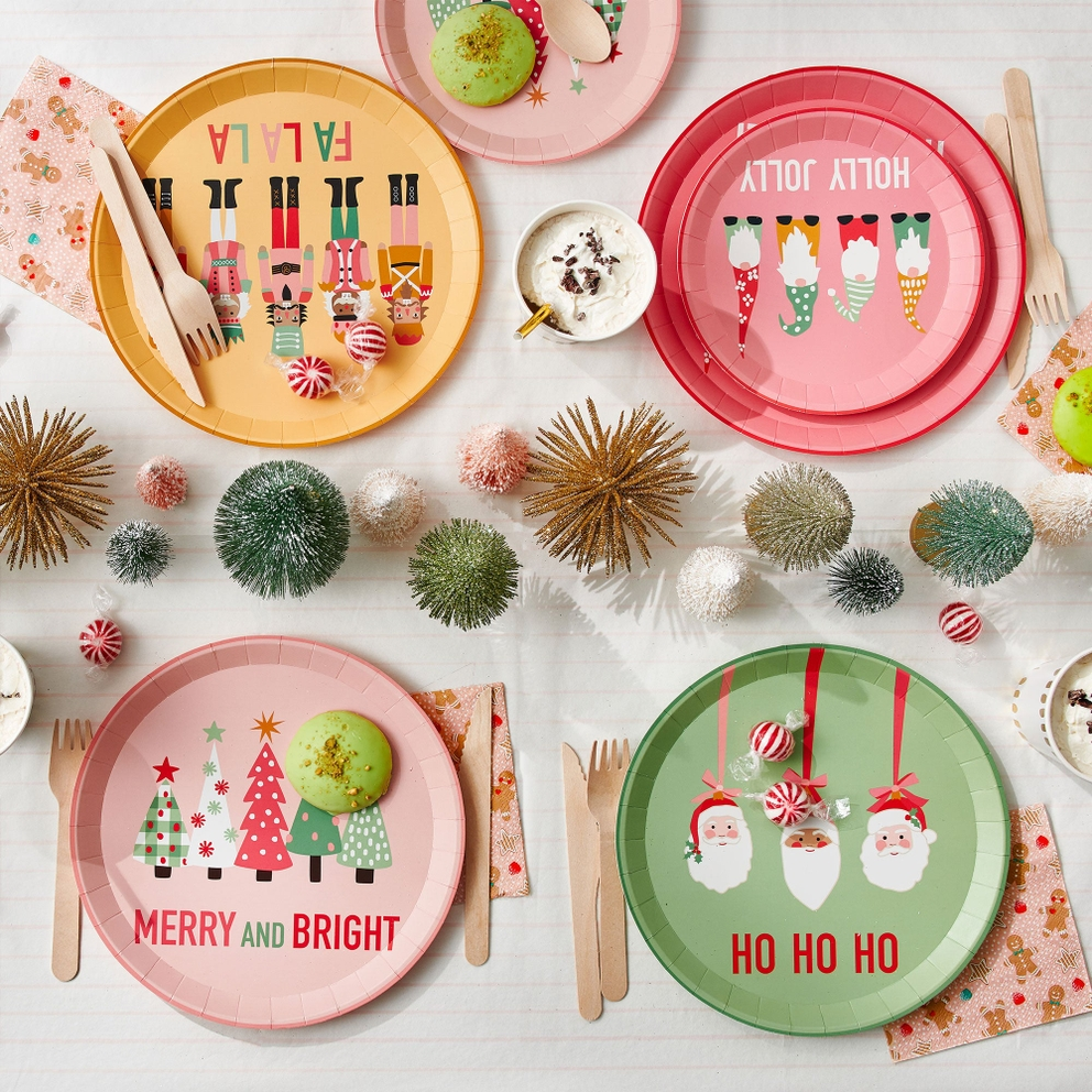 Multicolored Christmas dinner plates with festive characters holiday theme from Parte Haus party supply store in Bethesda Maryland