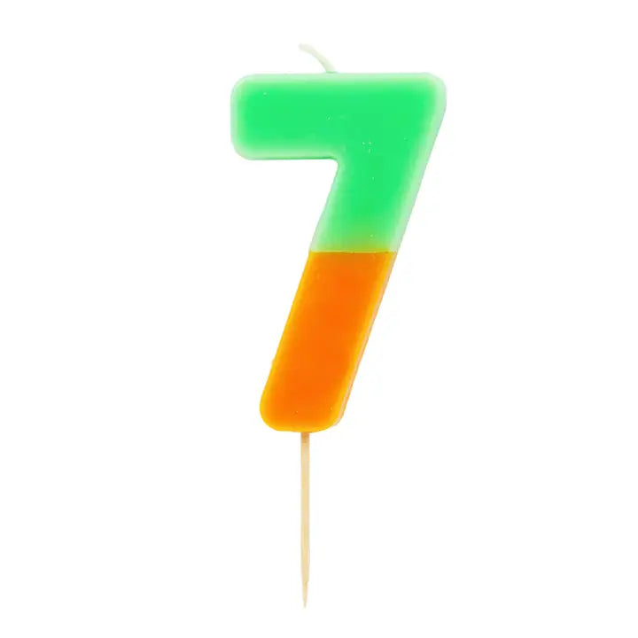 Multicolored number seven candle with green and orange ideal for birthdays from Parte Haus party supply store in Bethesda MD