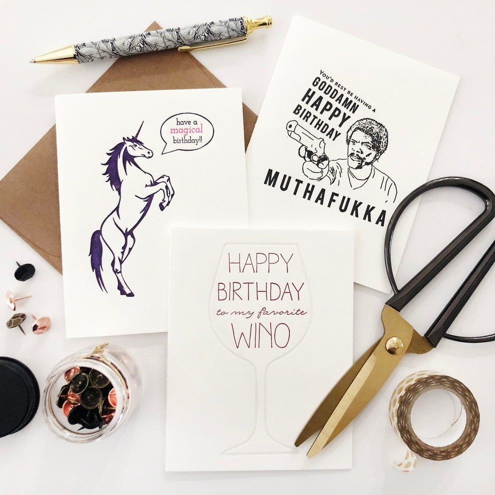 White and black funny birthday greeting cards with bold text from Parte Haus party supply store in Bethesda Maryland