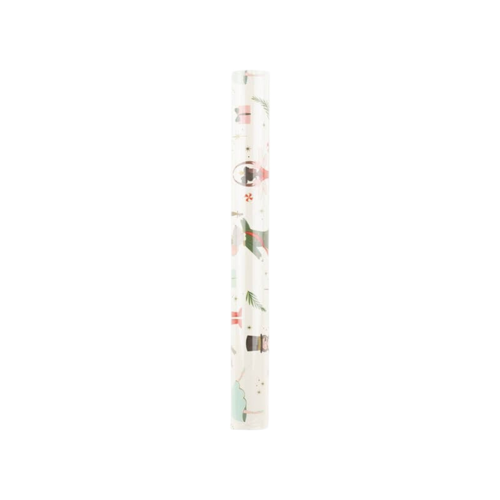White Christmas wrapping paper roll featuring festive Santa and tree designs holiday decor from Parte Haus party supply store in Bethesda Maryland