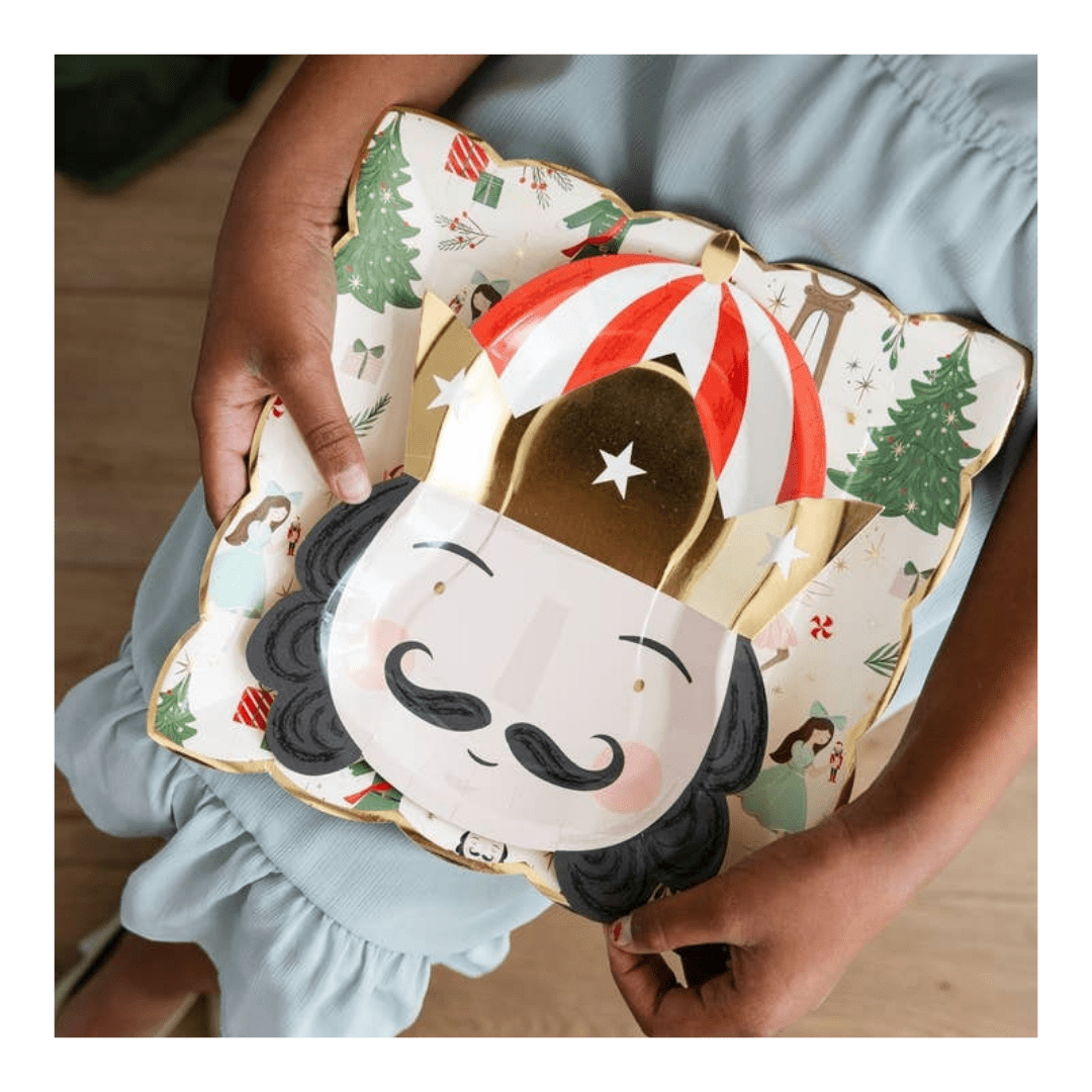 Christmas nutcracker paper plate with gold crown and festive trees from Parte Haus party supply store in Bethesda Maryland