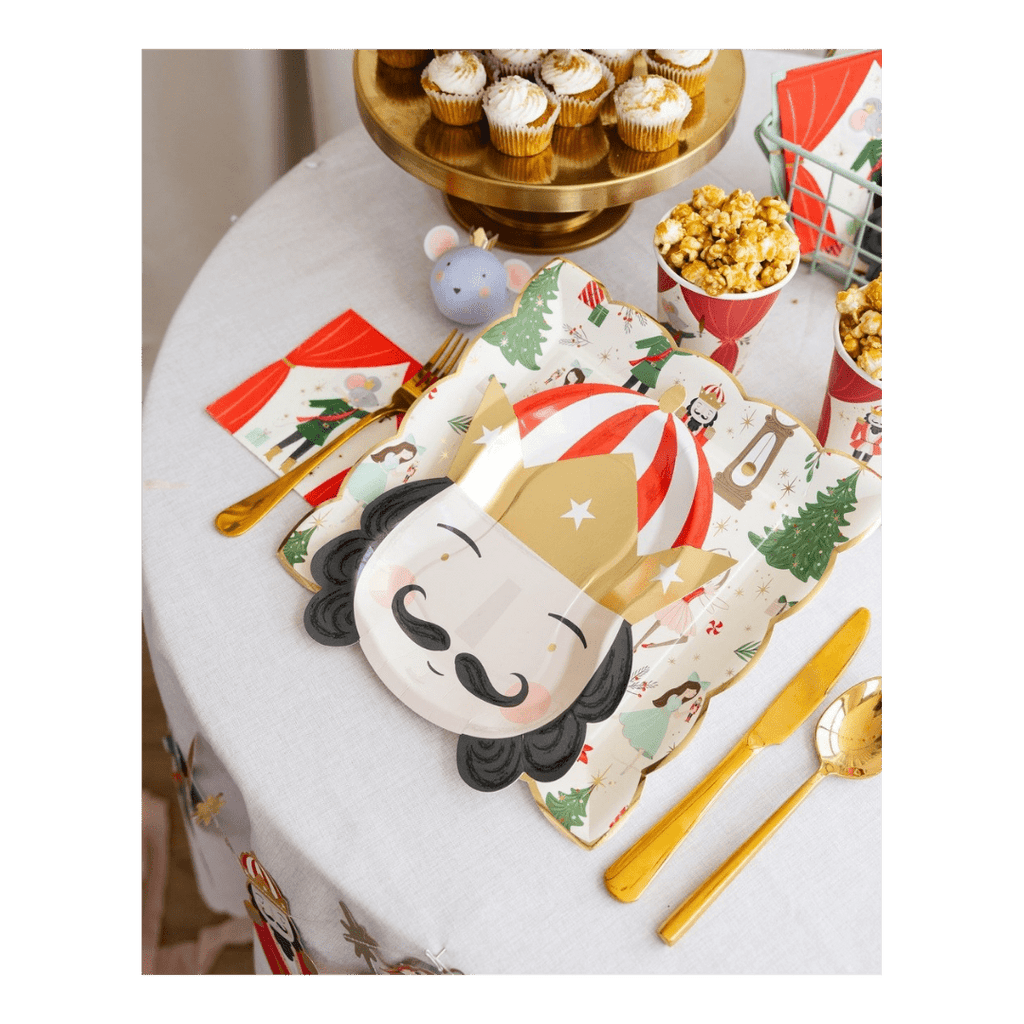 Red and gold nutcracker plate with holiday Christmas theme on festive table from Parte Haus party supply store in Bethesda MD.