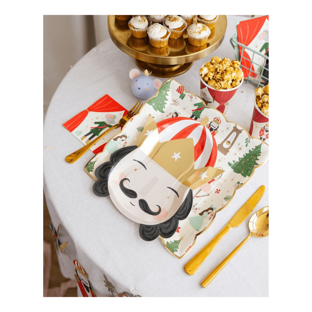 Red and gold nutcracker plate with holiday Christmas theme on festive table from Parte Haus party supply store in Bethesda MD.