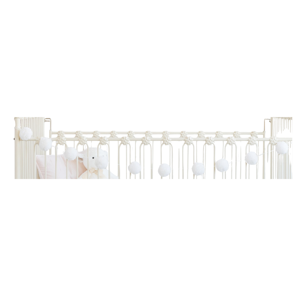 White pom pom garland soft hanging decor for baby shower from Parte Haus party supply store in Bethesda MD