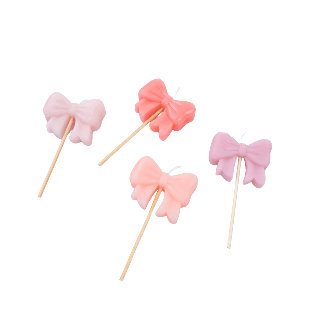Pink bow candle set with sticks birthday cake decoration from Parte Haus party supply store in Bethesda MD