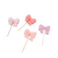 Pink bow candle set with sticks birthday cake decoration from Parte Haus party supply store in Bethesda MD