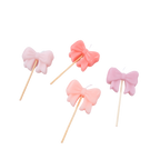 Pink bow candle set with sticks birthday cake decoration from Parte Haus party supply store in Bethesda MD