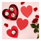 Red heart shaped plates with cupcakes and rose petals for Valentine’s Day from Parte Haus party supply store in Bethesda MD.
