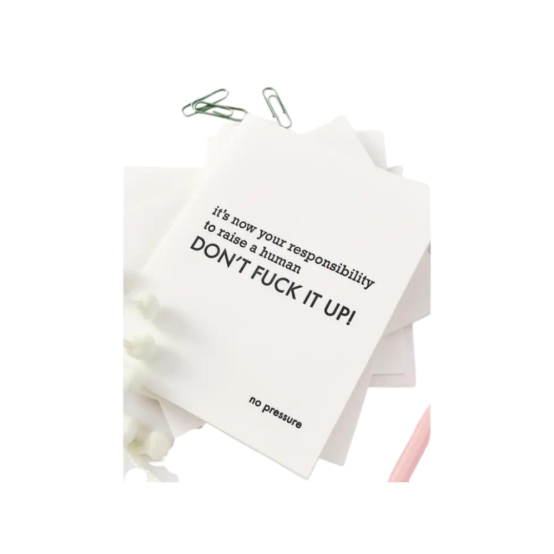 White letterpress congratulations card with humorous black text new baby theme from Parte Haus party supply store in Bethesda Maryland