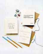 White funny letterpress new baby congrats cards with envelopes for new parents from Parte Haus party supply store in Bethesda Maryland