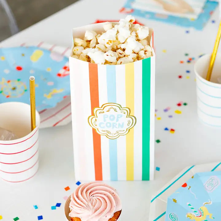 Colorful stripe popcorn favor bag with popcorn for carnival theme from Parte Haus party supply store in Bethesda MD